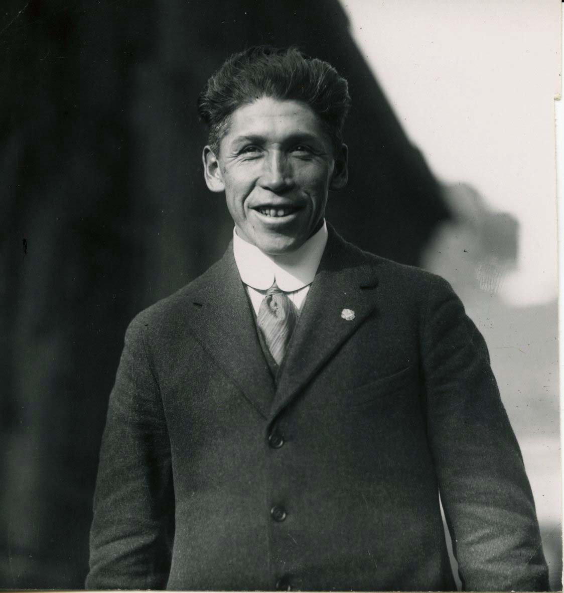 A black and white portrait photo of Tom Longboat.